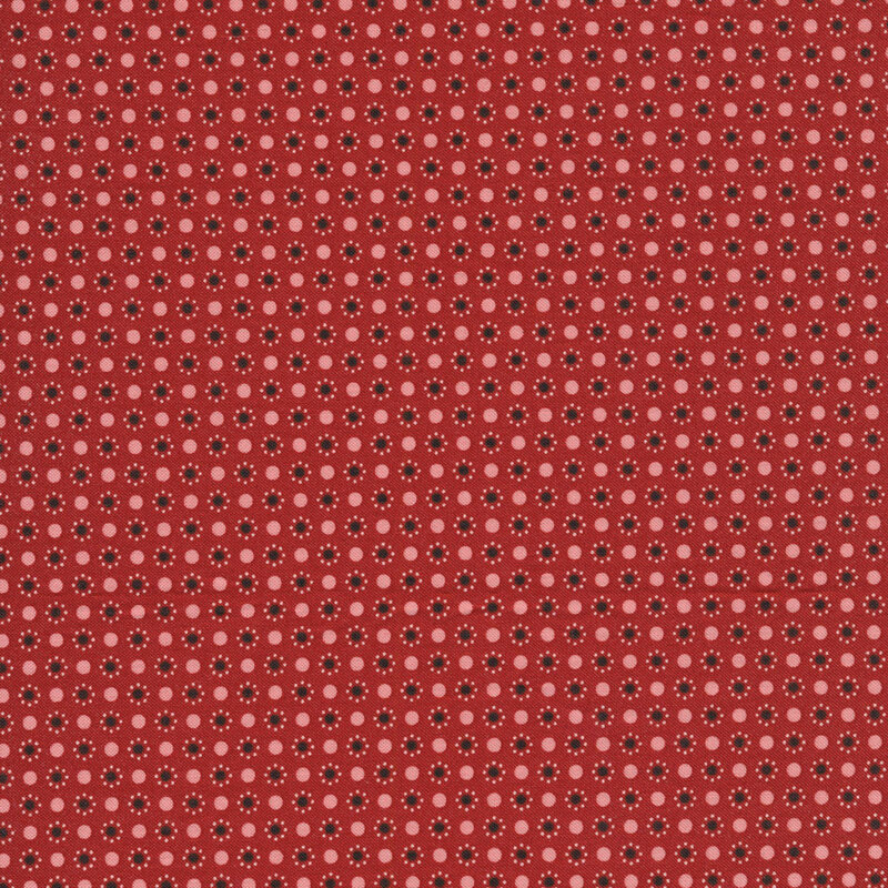 red fabric featuring brown polka dots with a circle of smaller pink dots around them and pink polka dots in between