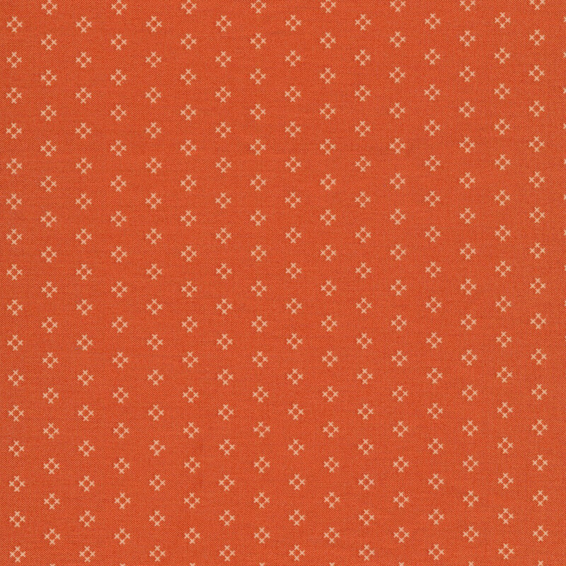 orange fabric featuring rows of cream hash marks