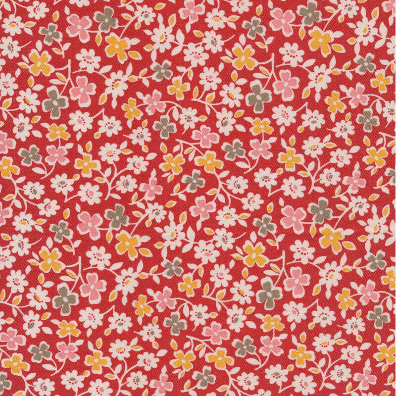 vivid red fabric featuring a scattered white floral design, with accents of brown, golden yellow, and pink