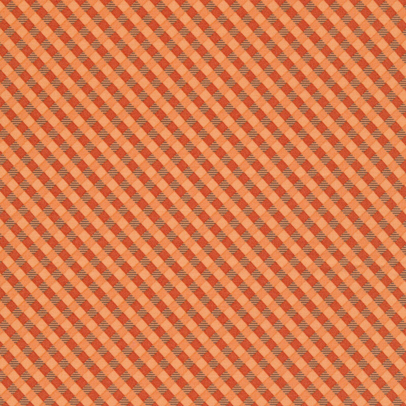 gorgeous orange gingham fabric featuring different shades of orange with dark brown striped accent squares