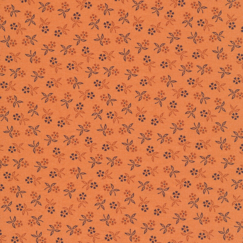 orange fabric featuring scattered flowers in dark shades of orange and blue