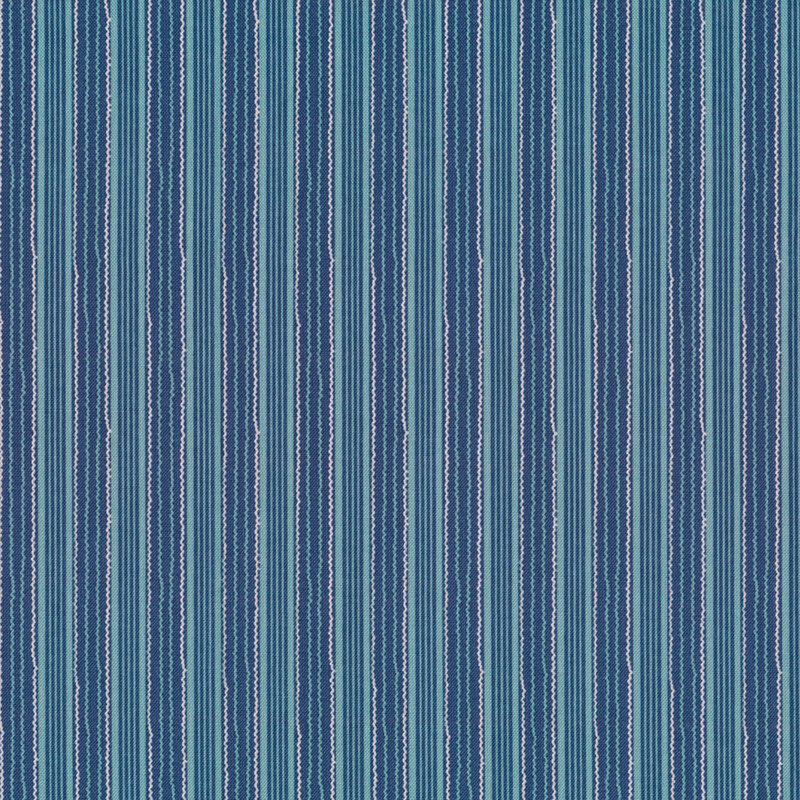 navy blue fabric featuring stripes in different widths and shades of blue and teal