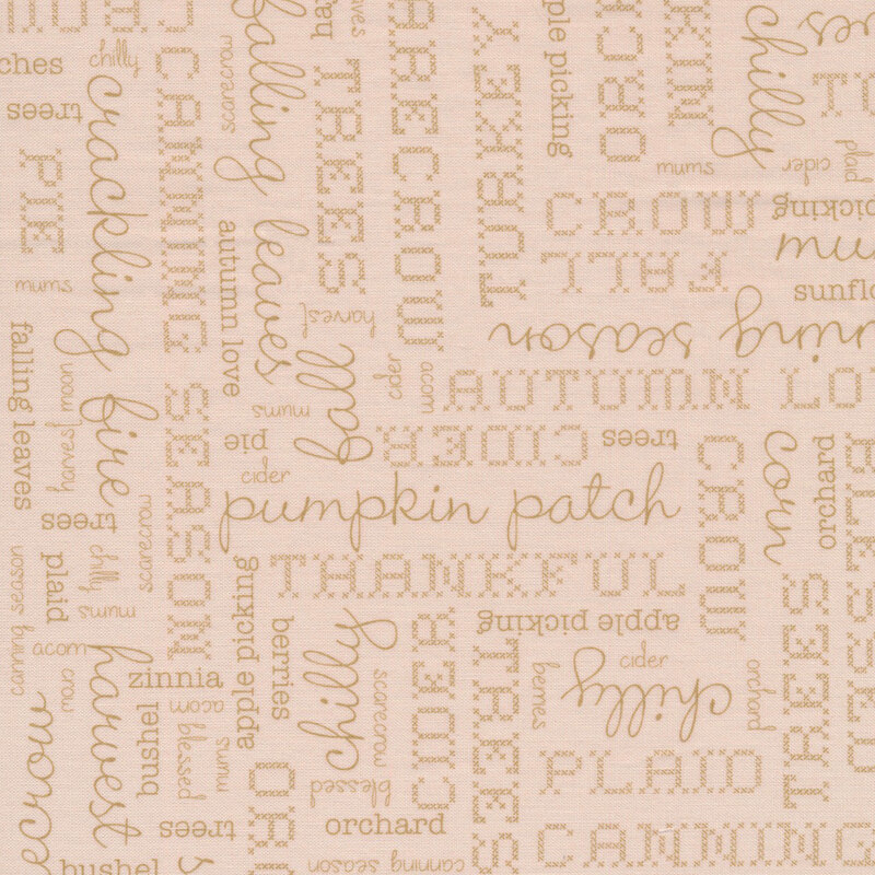 classic cream fabric featuring cream tonal words in different fonts pertaining to autumn