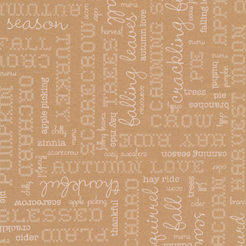 beige fabric featuring cream words in different fonts pertaining to autumn