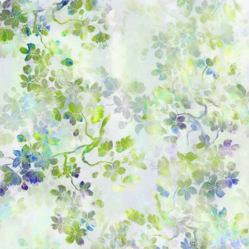 off white fabric featuring layers of mottled green, blue, and purple flowering branches