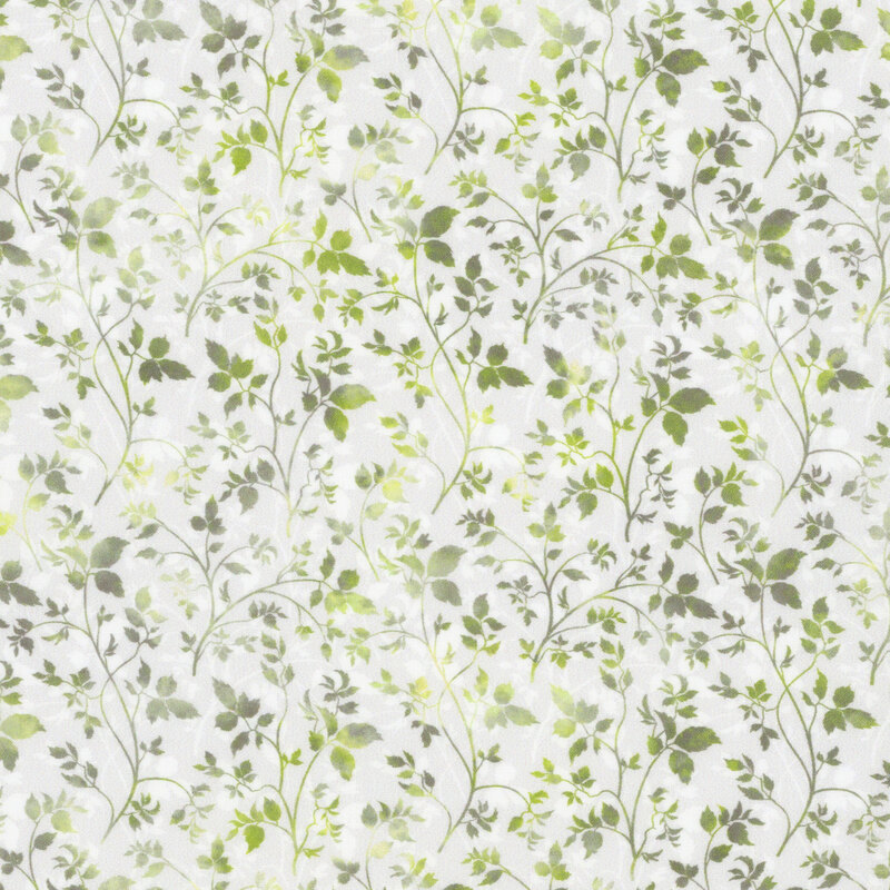 off white fabric featuring intertwining green mottled vines and leaves, with white vines in the background
