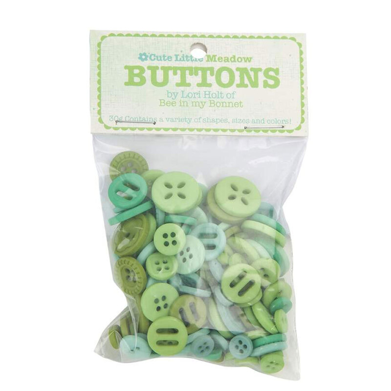 A pack of green buttons in a small plastic package