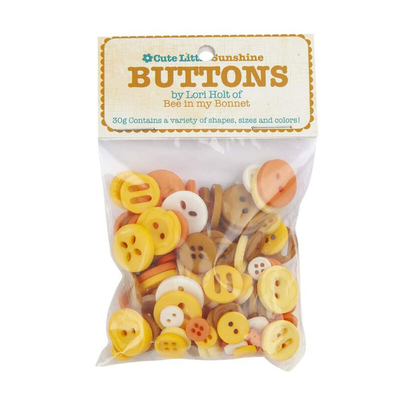 A pack of yellow buttons in a small plastic package