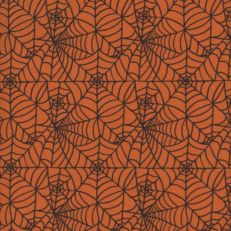 Orange fabric featuring a delicate and intricate black spiderweb design