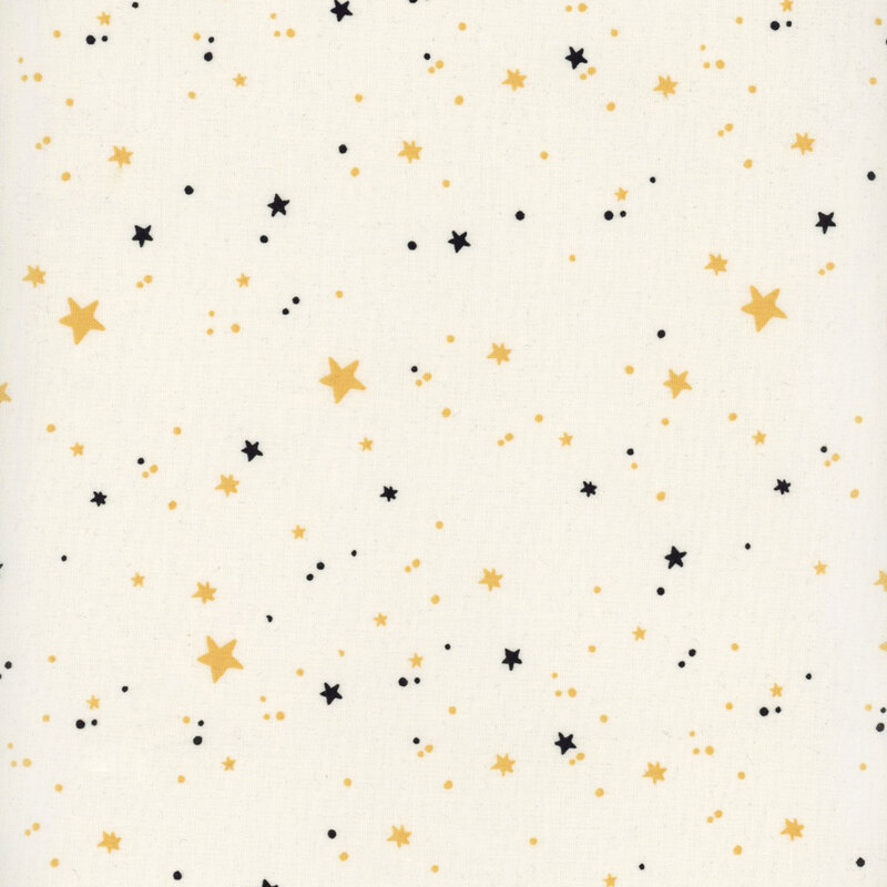 Cream fabric featuring scattered black and yellow stars