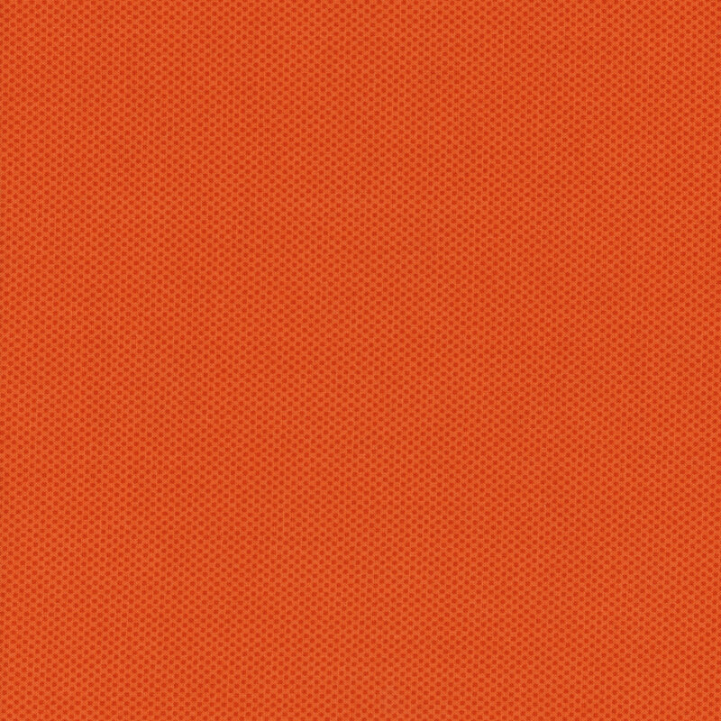 fabric featuring a dotted halftone orange print
