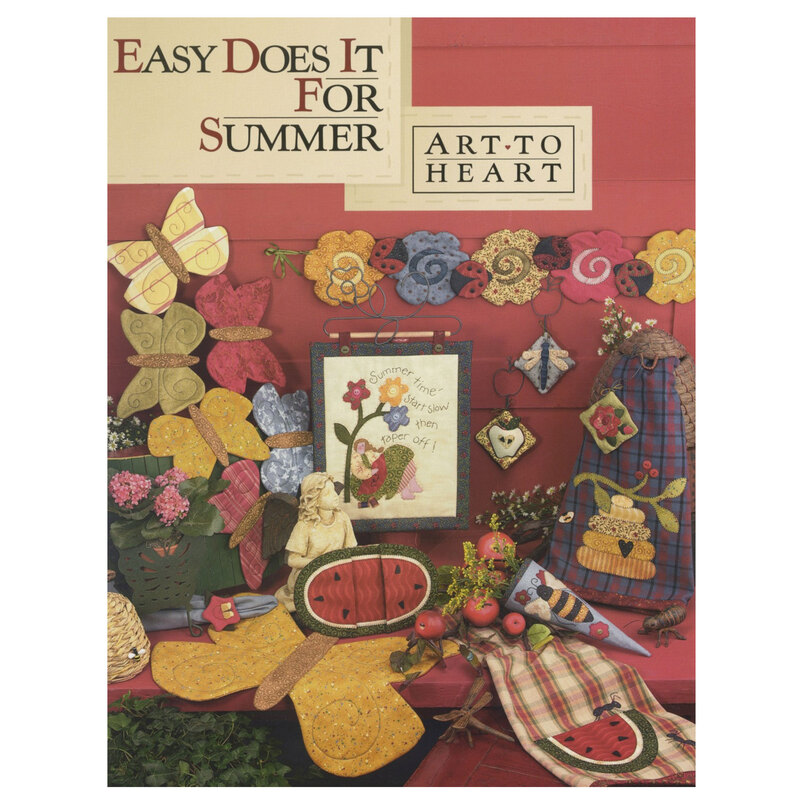 Front cover of the easy does it for summer pattern book displaying multiple summer projects including a pillows, wall hangings, table runners, pot holders, and more