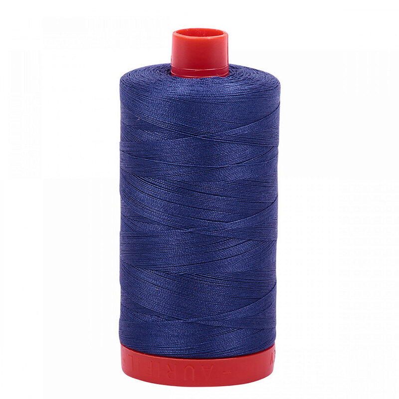 A spool of Aurifil 2775 - Steel Blue thread on a white background
