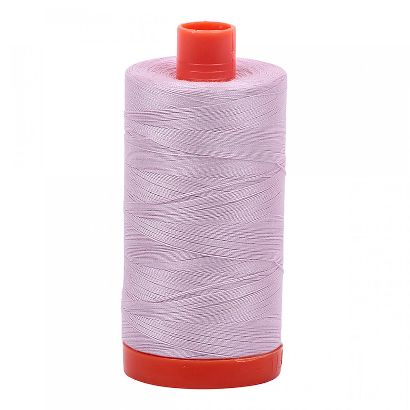 A spool of Aurifil 2564 - Pale Lilac thread on a white background