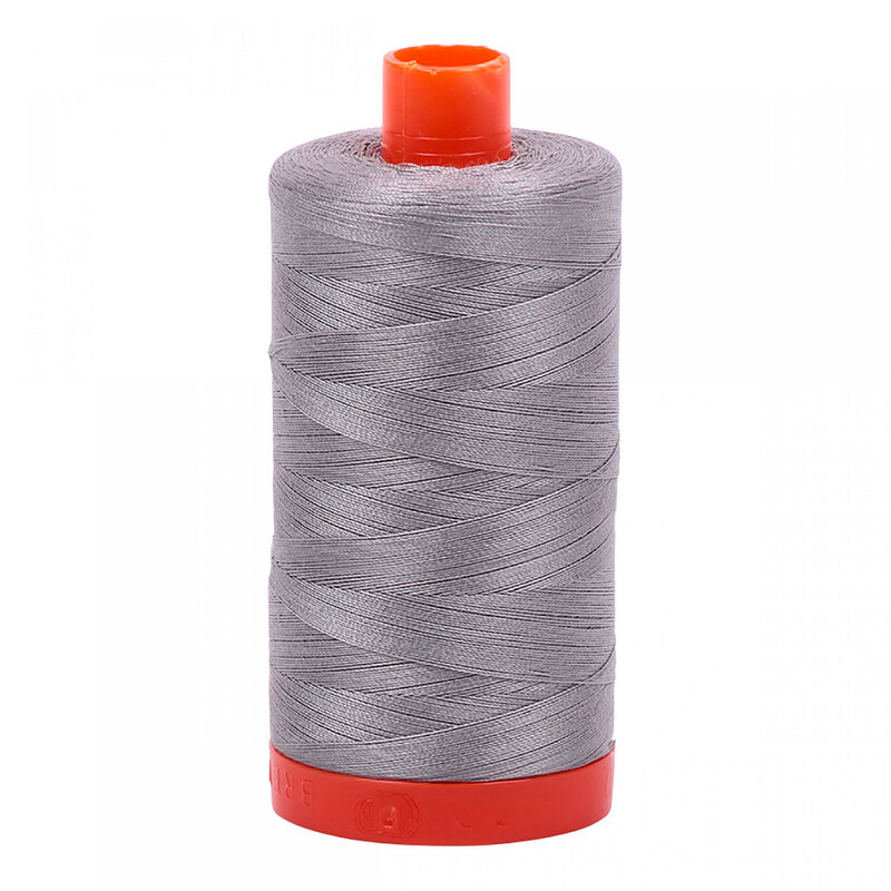 A spool of Aurifil 2620 - Stainless Steel thread on a white background