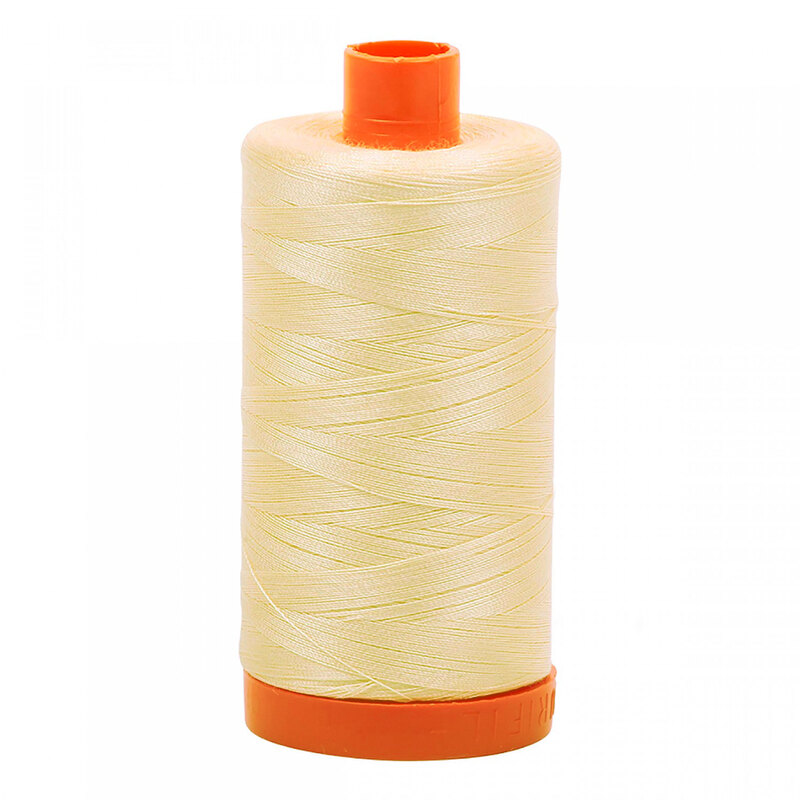 A spool of Aurifil 2123 - Butter thread on a white background