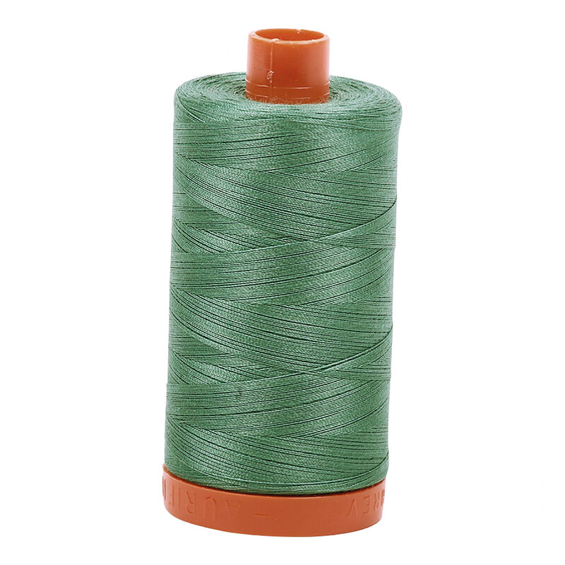 A spool of Aurifil 2850 -Medium Juniper thread on a white background
