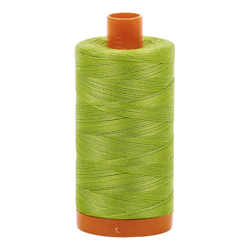 A spool of Aurifil 1231 -Spring Green thread on a white background