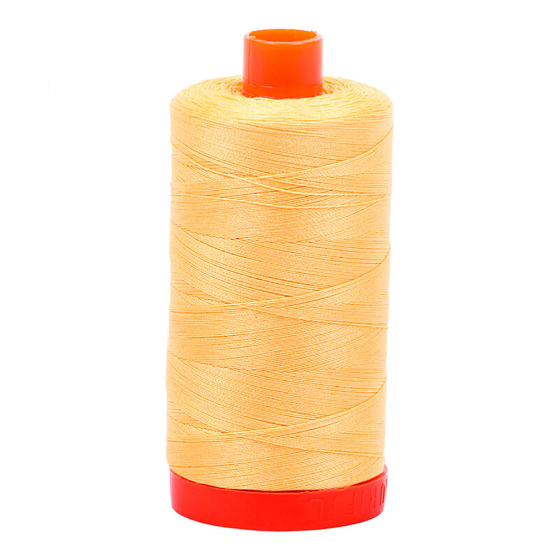 A spool of Aurifil 2130 -Medium Butter thread on a white background