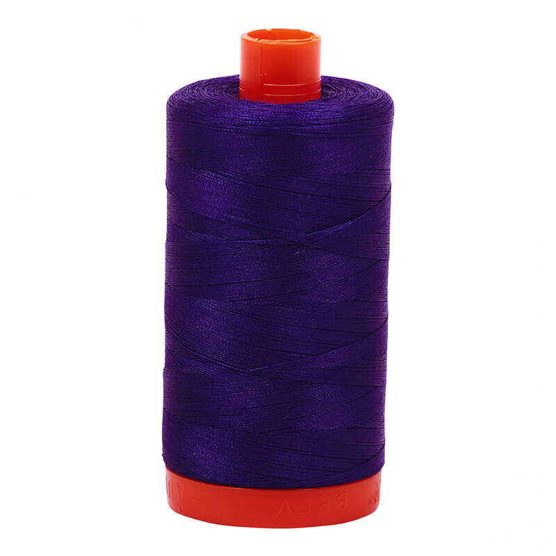 A spool of Aurifil 1200 -Blue Violet thread on a white background