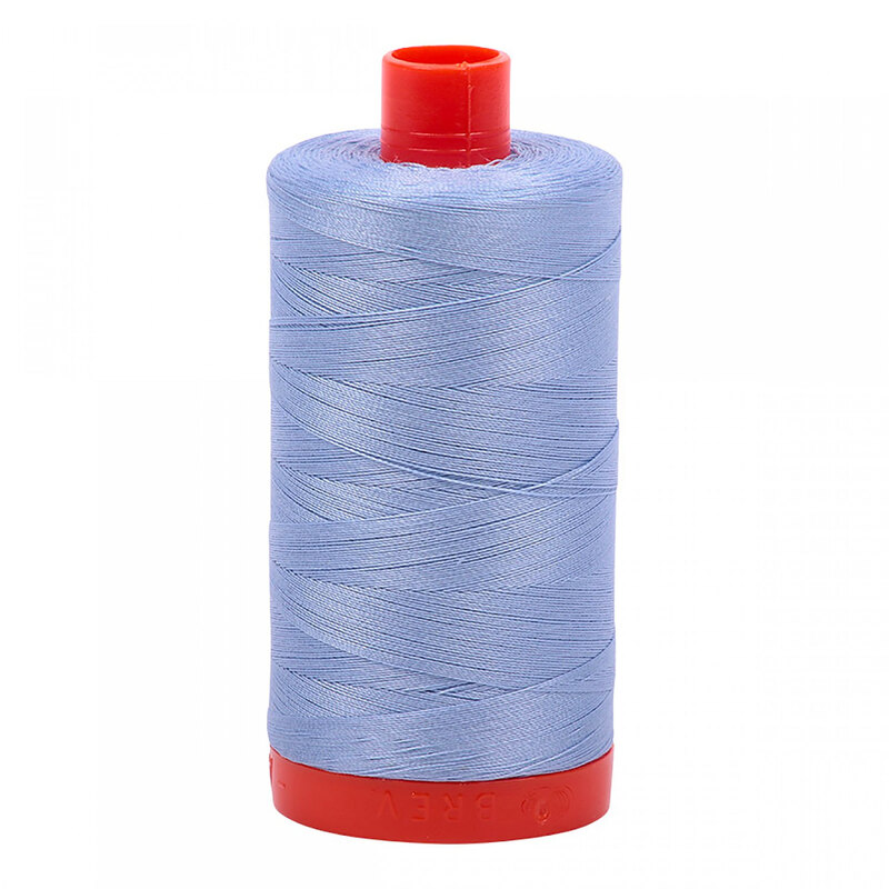 A spool of Aurifil 2770 -Very Light Delft thread on a white background