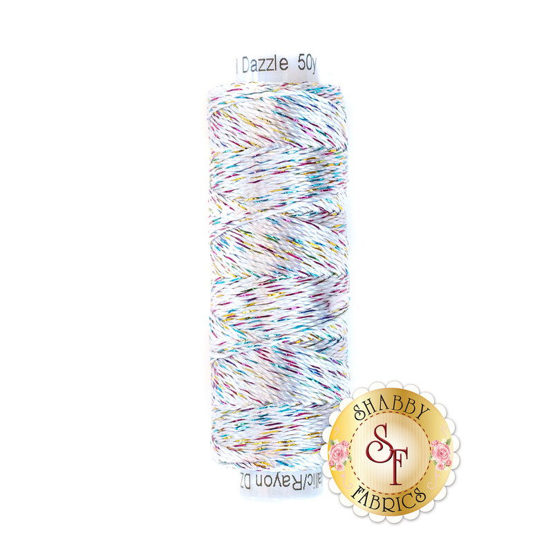 Photo of white embroidery thread with pink, yellow, and blue metallic accents isolated on a white background