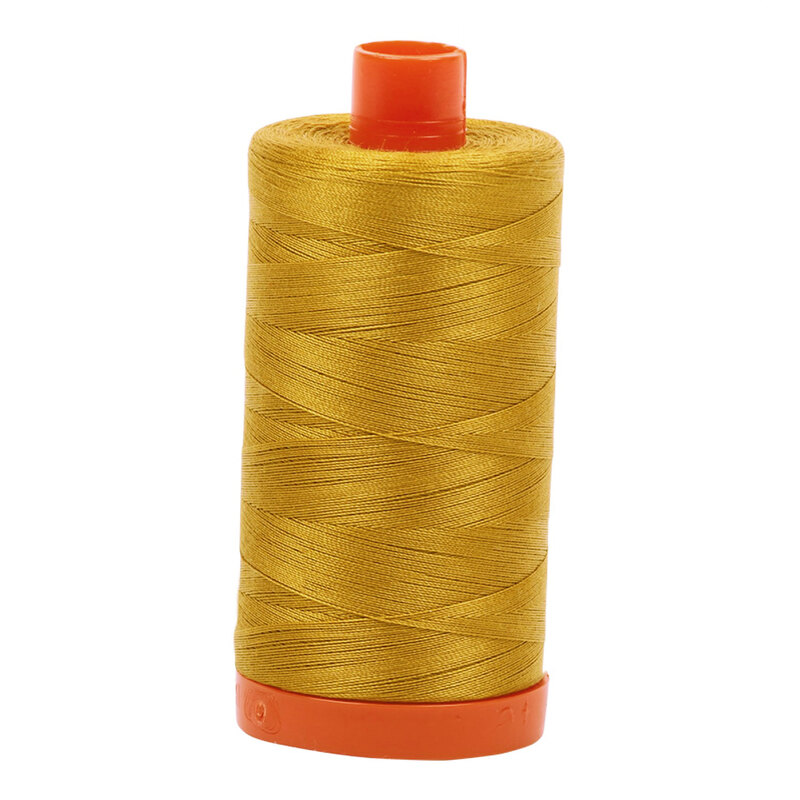 A spool of Aurifil 5002 -Mustard thread on a white background