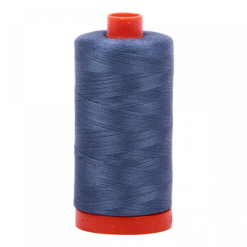 A spool of Aurifil 1248 - Dark Grey Blue thread on a white background