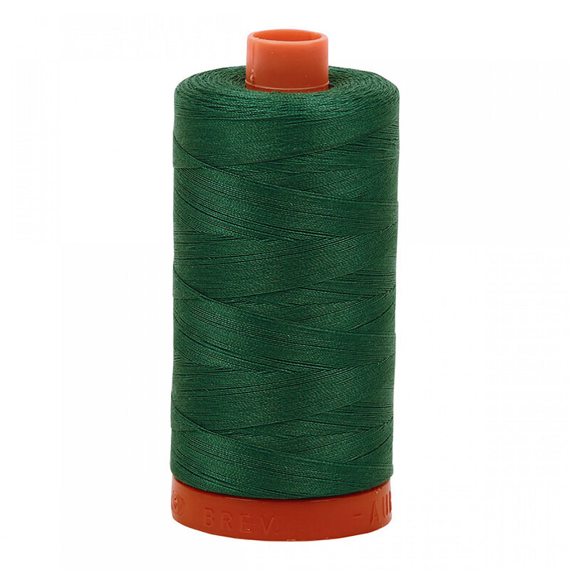 A spool of Aurifil 4129 - Turf Green thread on a white background