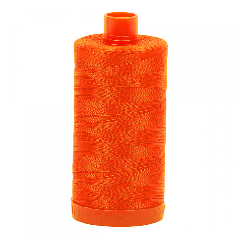 A spool of Aurifil 1104 - Neon Orange thread on a white background