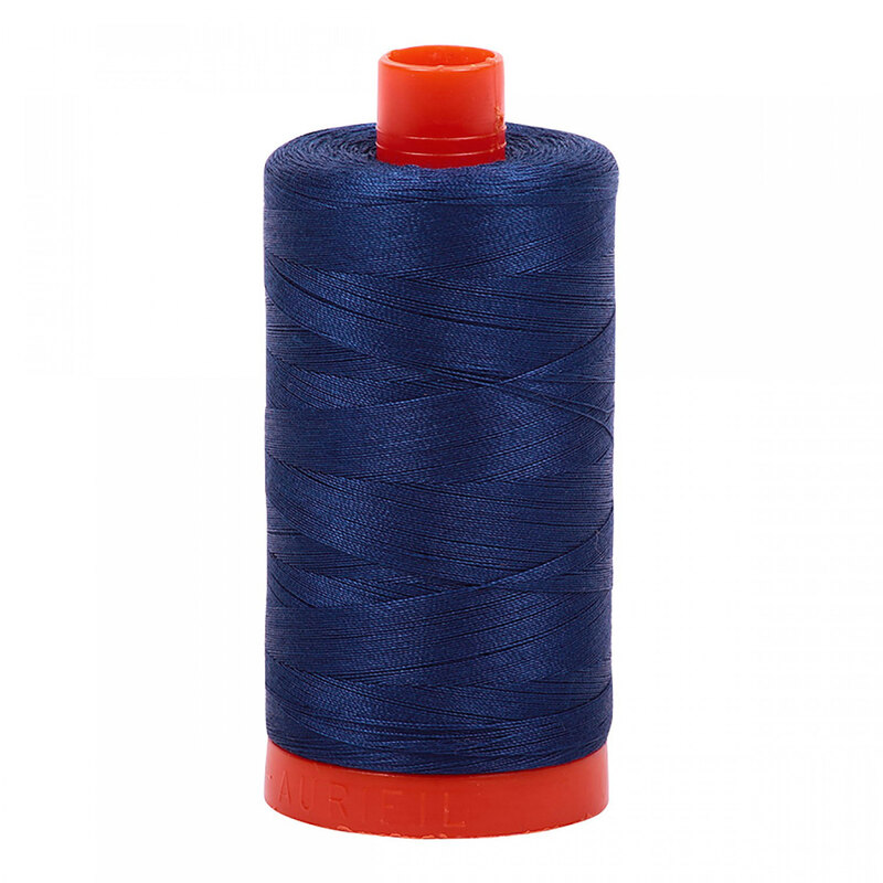 A spool of Aurifil 2780 - Dark Delft Blue thread on a white background