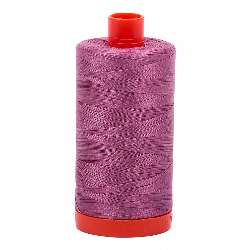 A spool of Aurifil 5003 - Wine thread on a white background
