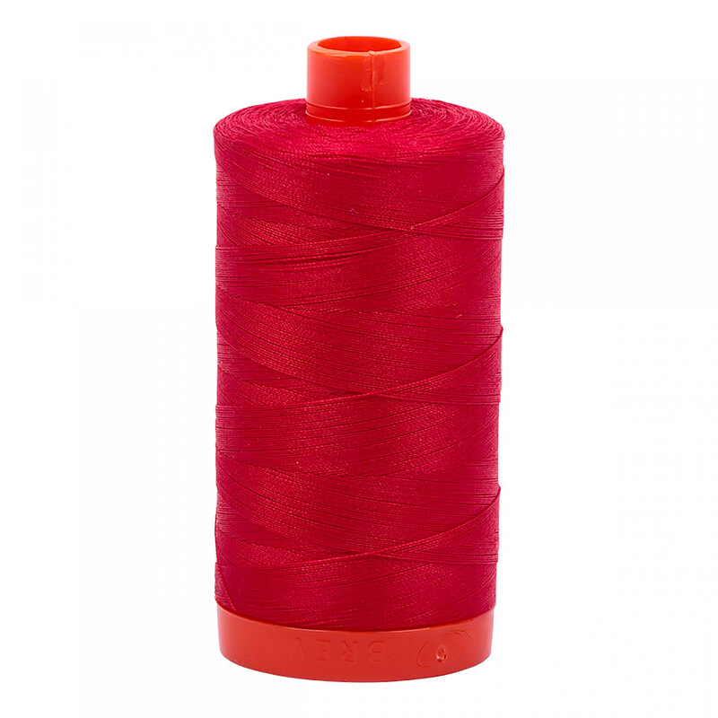 A spool of Aurifil 2250 - Red thread on a white background