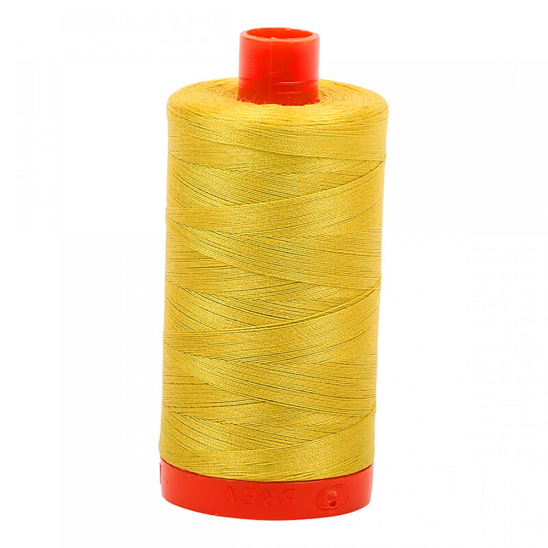 A spool of Aurifil 5015 - Gold Yellow thread on a white background