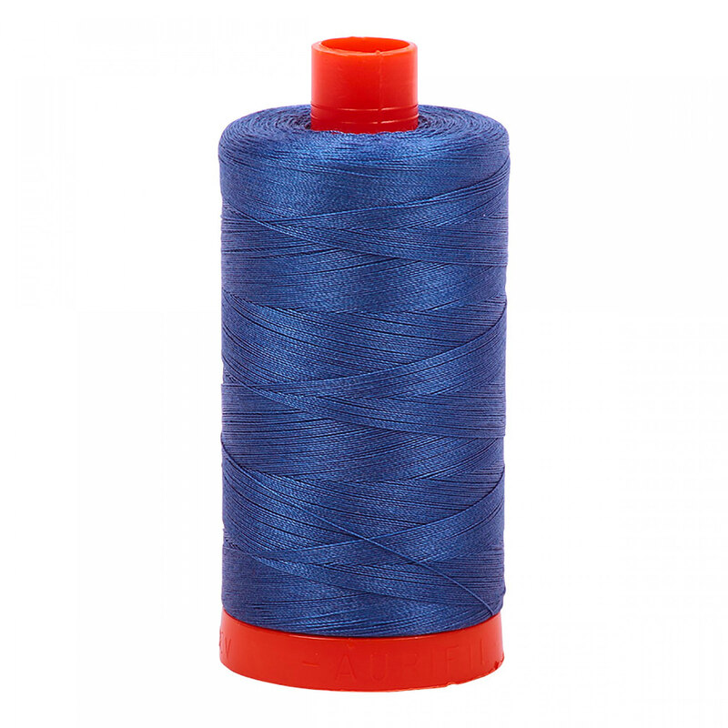 A spool of Aurifil 2730 - Delft Blue thread on a white background