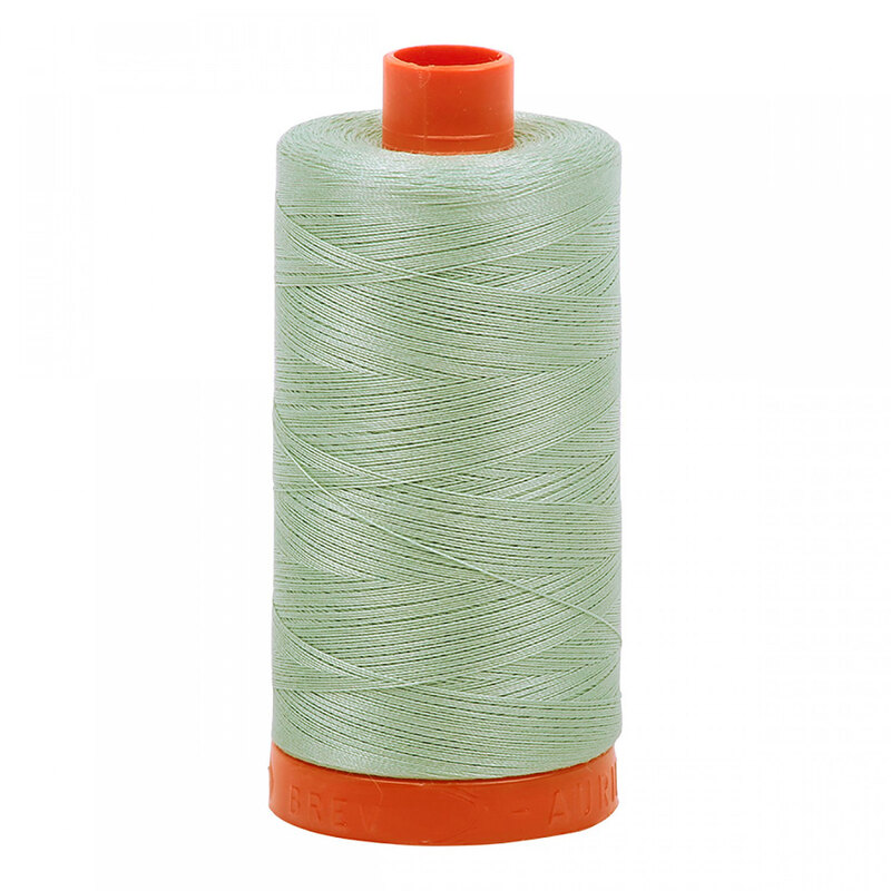 A spool of Aurifil 5014 - Marine Water thread on a white background