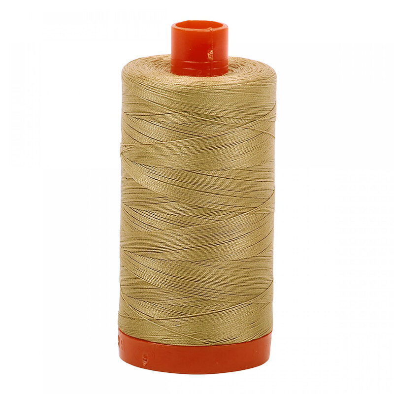 A spool of Aurifil 5010 - Blond Beige thread on a white background