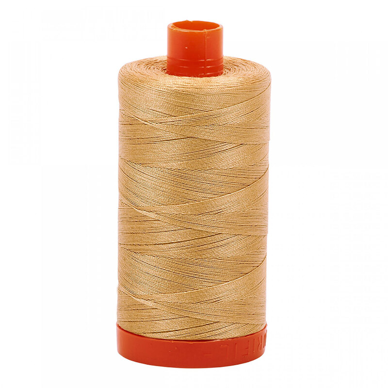 A spool of Aurifil 2318 -Cachemire thread on a white background