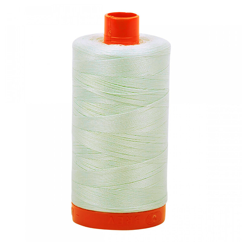 A spool of Aurifil 2800 -Mint Ice thread on a white background