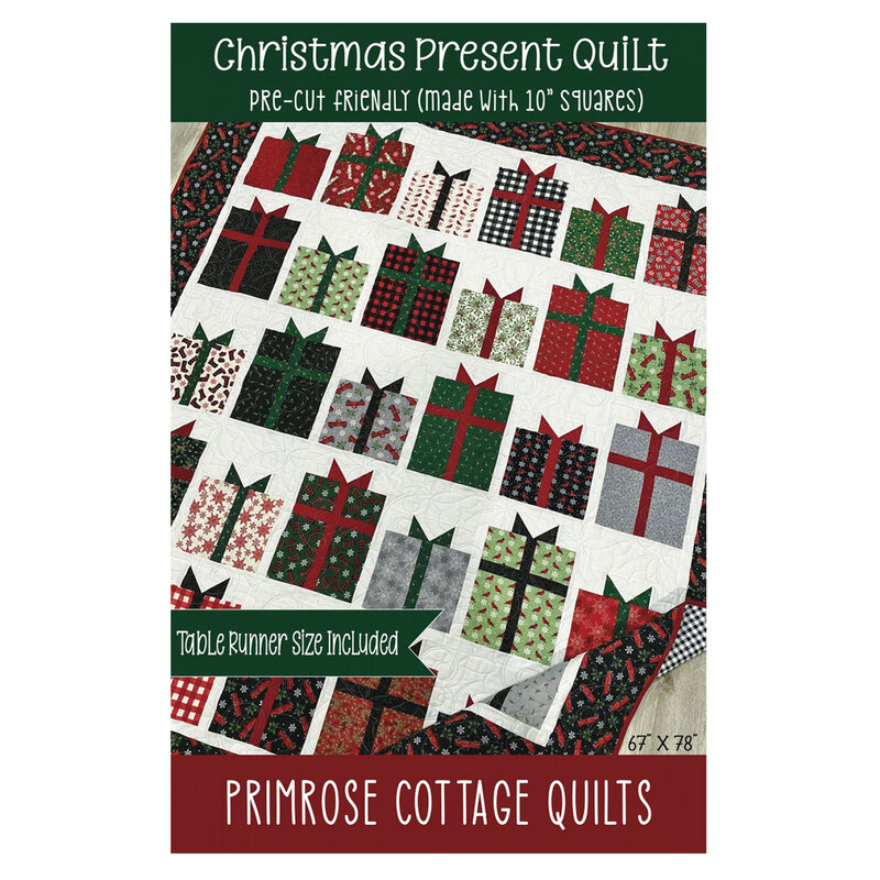 Front cover of the Christmas Presents Quilt pattern booklet featuring a photo of the completed project with title and designer info.