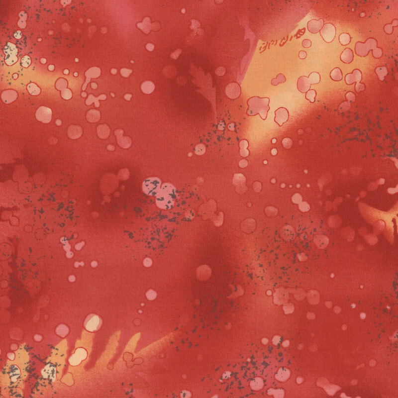 fabric featuring a warm red watercolor background with complementary mottling and abstract fern designs