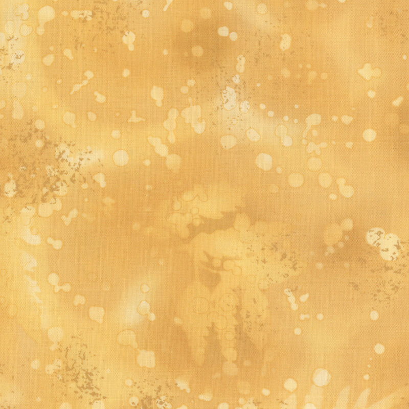 fabric featuring a tan yellow watercolor background with complementary mottling and abstract fern designs