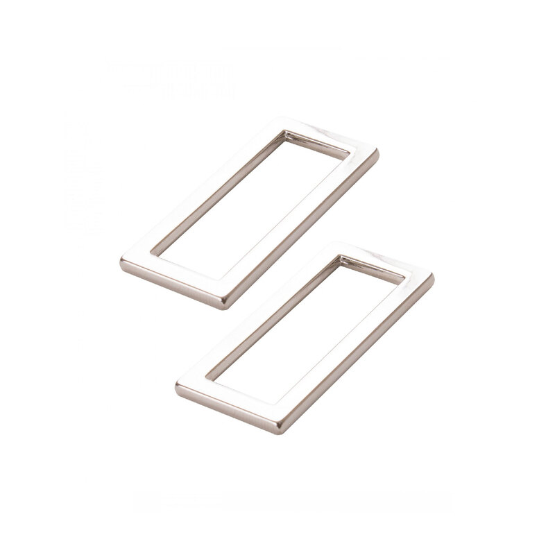 2 nickel-plated metal rectangle rings on a white background