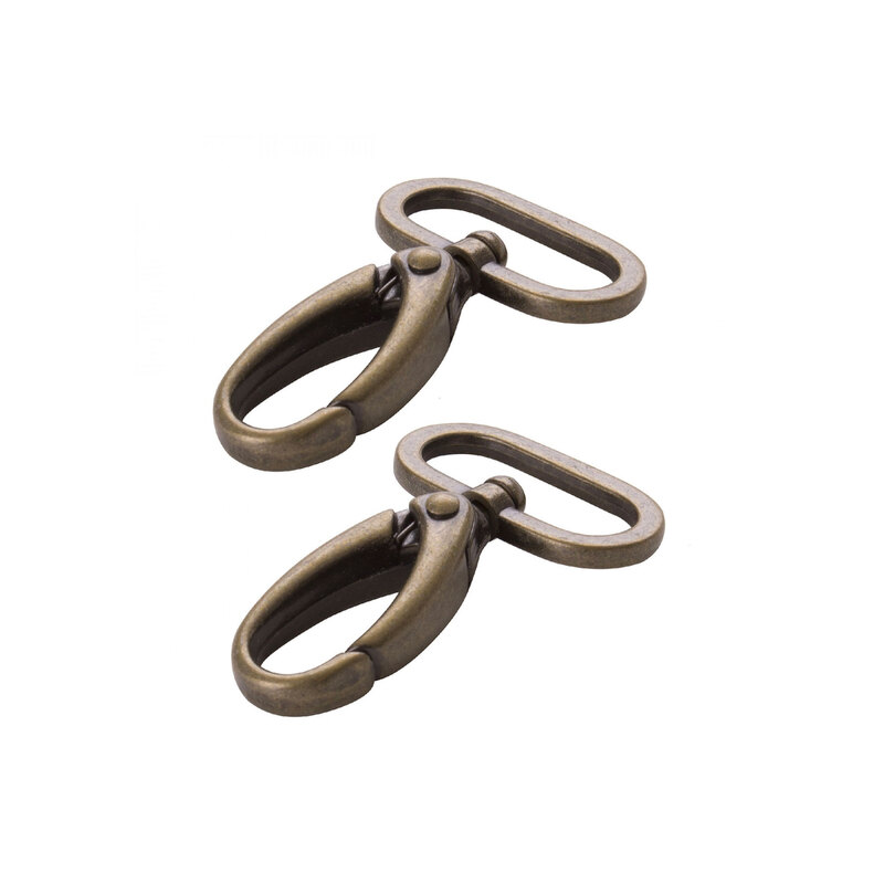 2 antique brass finished metal swivel hooks on rings on a white background