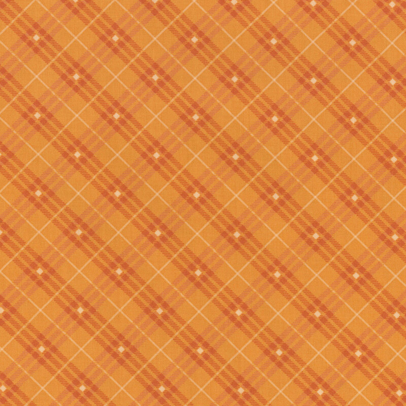 orange plaid fabric with white stripes and diamonds