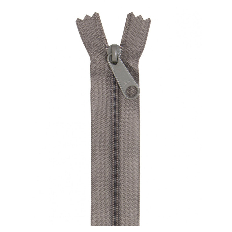 Photo of a taupe zipper isolated on a white background