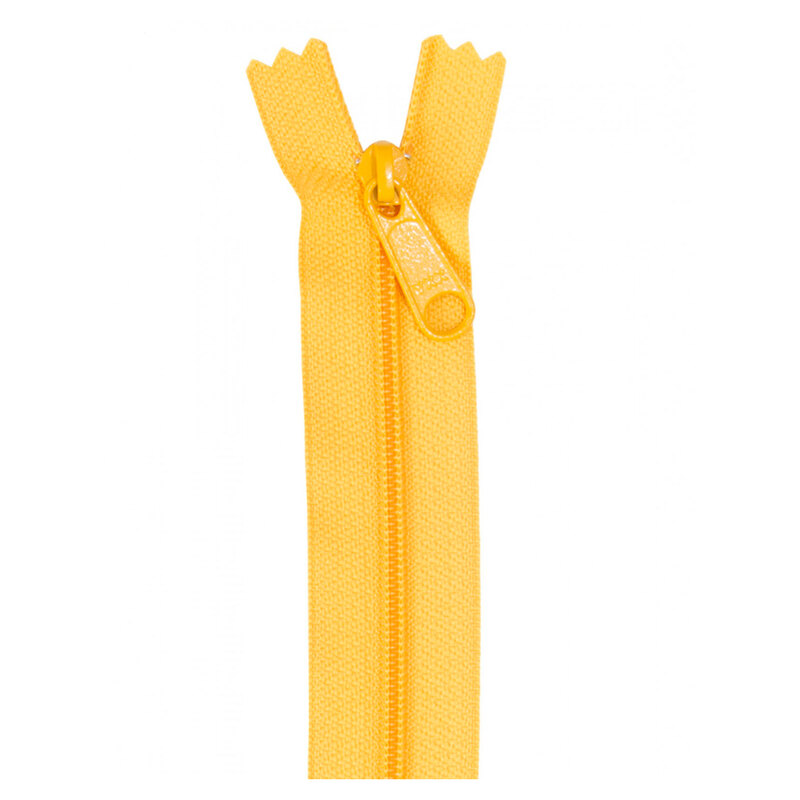 Photo of a yellow zipper isolated on a white background