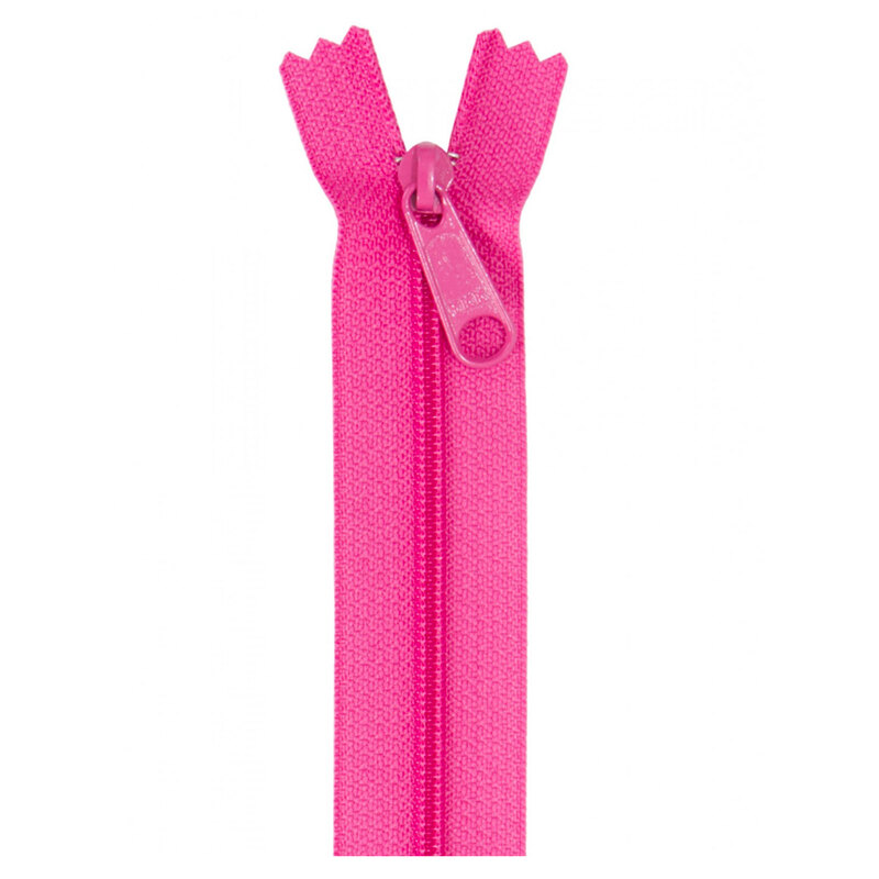 Photo of a hot pink zipper isolated on a white background