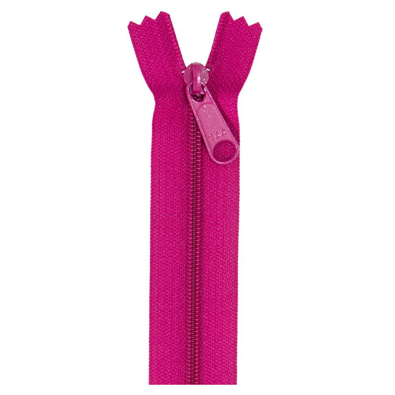 Photo of a dark hot pink zipper isolated on a white background