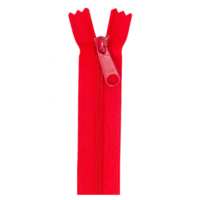 Photo of a red zipper isolated on a white background
